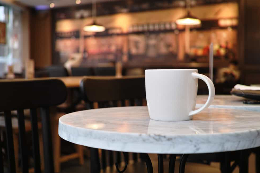 Cup Of Coffee On Table Cup Of Coffee On Table